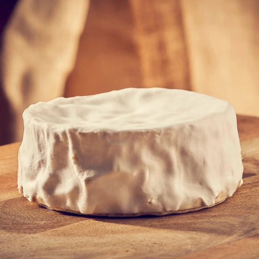The cheese is mildly tangy when young, but as it matures it will develop rich, complex flavours of mushroom and salted cream that meld beautifully together.   The white velvety mould encases a soft and creamy interior. During maturation the rind may develop small patches of orange mould.