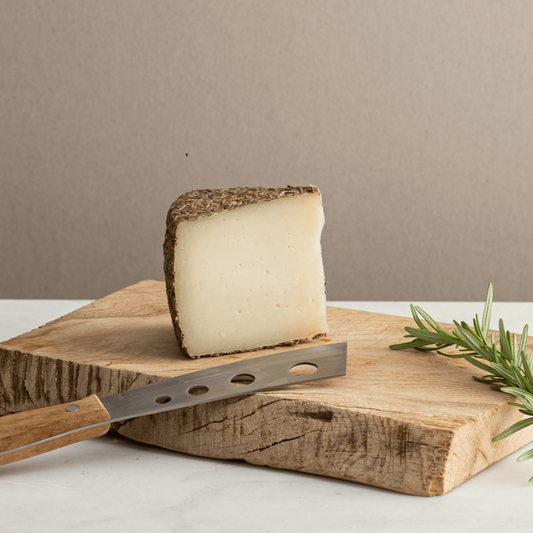 Queso de Cabra al Romero is a goat milk cheese from Piedrabuena, a lush pastoral area in central Spain. The rich pasture makes for very high quality milk which is certainly evident in the final product.