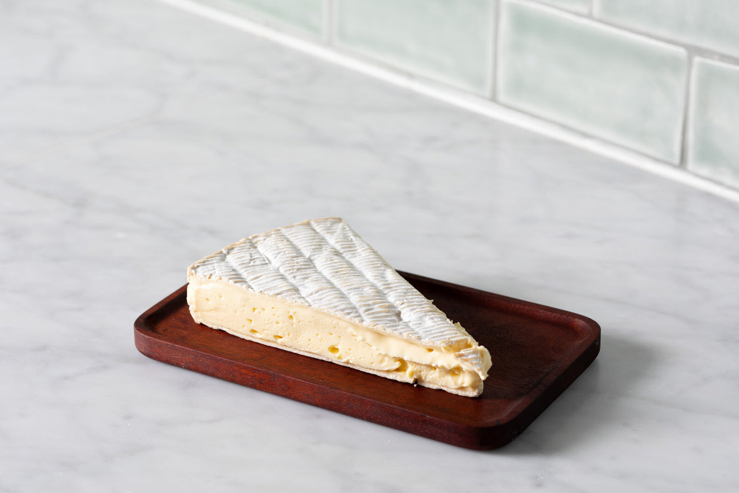 The velvety rind reveals mushroom and yeasty aromas with soft yeast and hazelnut notes. The centre of the cheese is rich and creamy with a smooth, supple texture. When fully ripe it will develop some brown rusty patches on the rind, ooze from the centre and have a robust flavour.