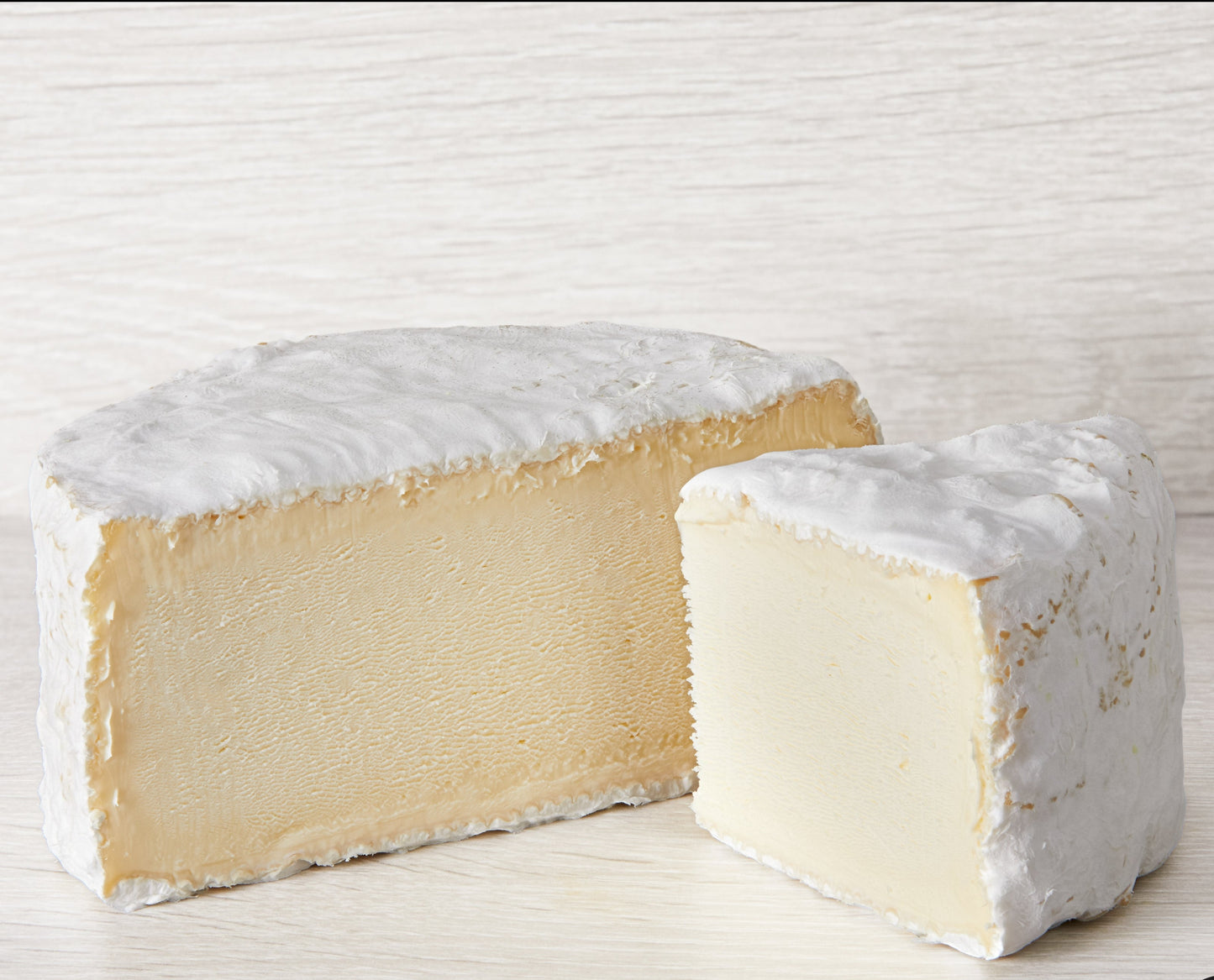 The cheese is mildly tangy when young, but as it matures it will develop rich, complex flavours of mushroom and salted cream that meld beautifully together. The white velvety mould encases a soft and creamy interior. During maturation the rind may develop small patches of orange mould.