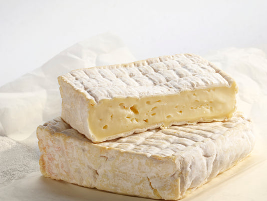 The interior of the cheese is creamy yellow with a smooth texture. The slightly crusty rind is orange and grey in colour and gradually reddens and becomes sticky over time.  A young Pont l’Evêque has a characteristic smoky flavour developing more toward hazelnuts with age.