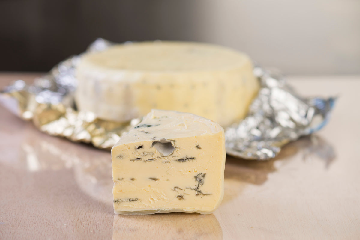 This mild, double cream blue is matured for 2 months under a wax coating after which time it is spiked, allowing air to enter the cheese’s interior and the oxygen-loving blue mould to proliferate. The texture is creamy and smooth and the flavour buttery and rich with mild stunning blue notes.