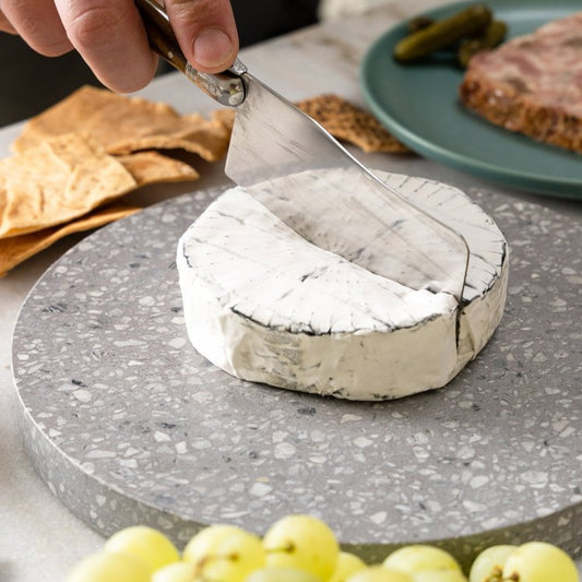 Milk is sourced from local dairies and used to make this brie which has a well-balanced medium strength flavour profile. The delicate white bloomy rind covers a coating of ash around the paste, giving the ashed brie its unique appearance.  The interior is pale yellow with a buttery and fresh mushroom flavour.