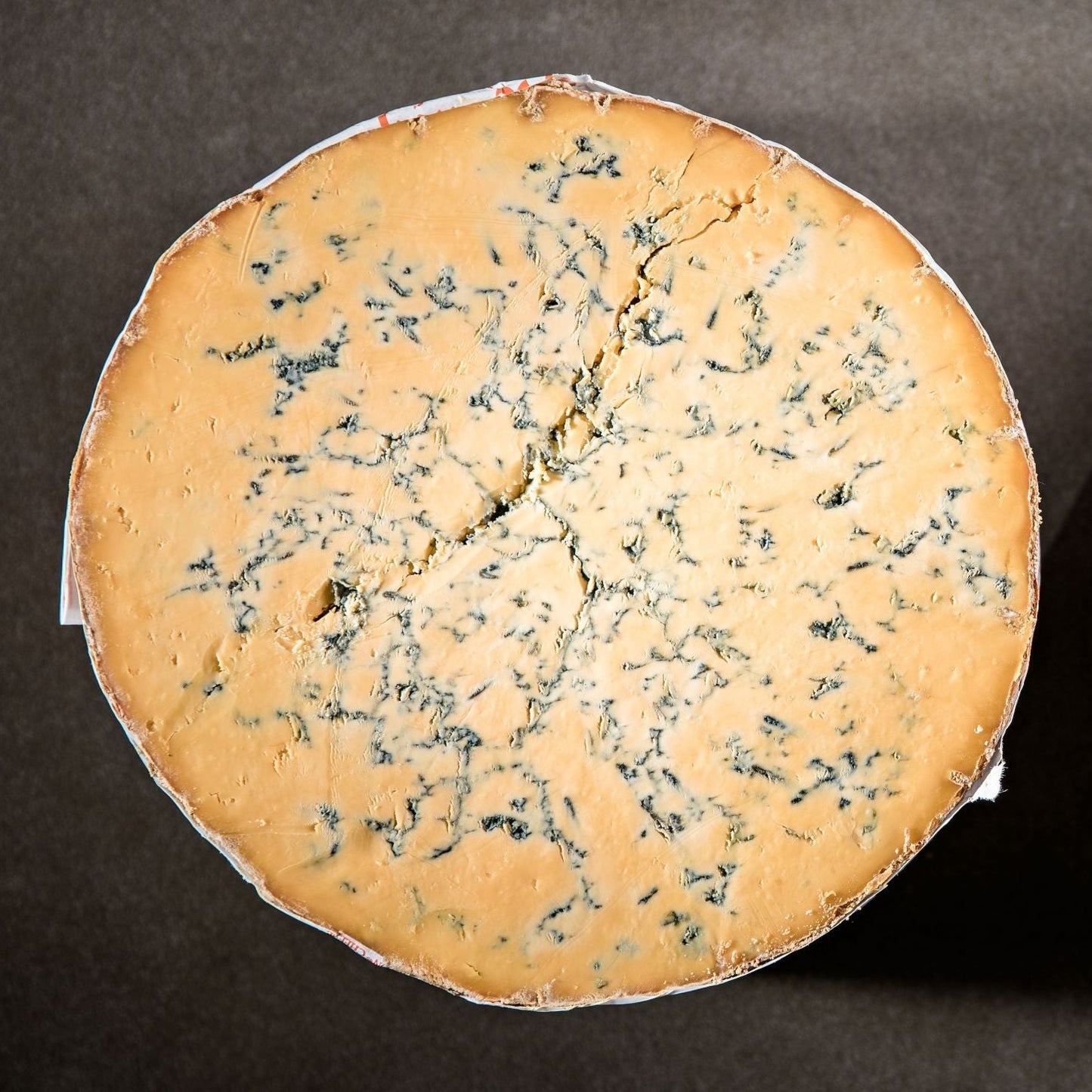 Traditionally made and lovingly matured, this mellow cheese is the pride of the Master Cheesemakers. The perfect Shropshire Blue is a rich orange colour with distinctive deep blue veining and a golden crust. It has a moist, crumbly, and slightly chalky texture with a bold blue flavour.