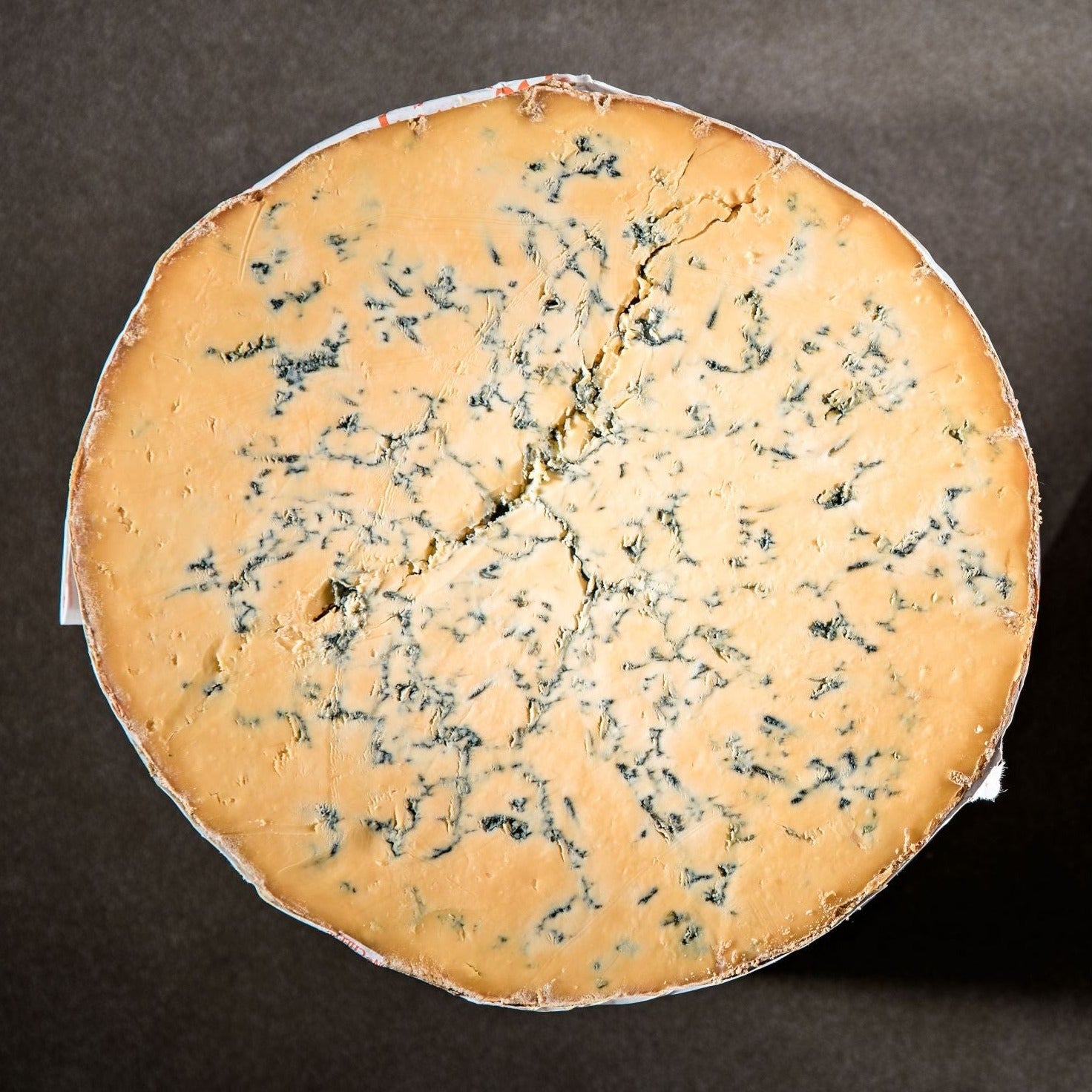 Traditionally made and lovingly matured, this mellow cheese is the pride of the Master Cheesemakers. The perfect Shropshire Blue is a rich orange colour with distinctive deep blue veining and a golden crust. It has a moist, crumbly, and slightly chalky texture with a bold blue flavour.