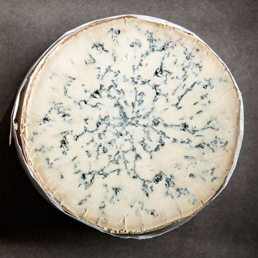 This Stilton has a crumbly and creamy paste with a naturally earthy rind. Its creamy pale yellow interior is laced with deep blue veins radiating from the centre. It has a bold aroma and a characteristically tangy, slightly metallic flavour.