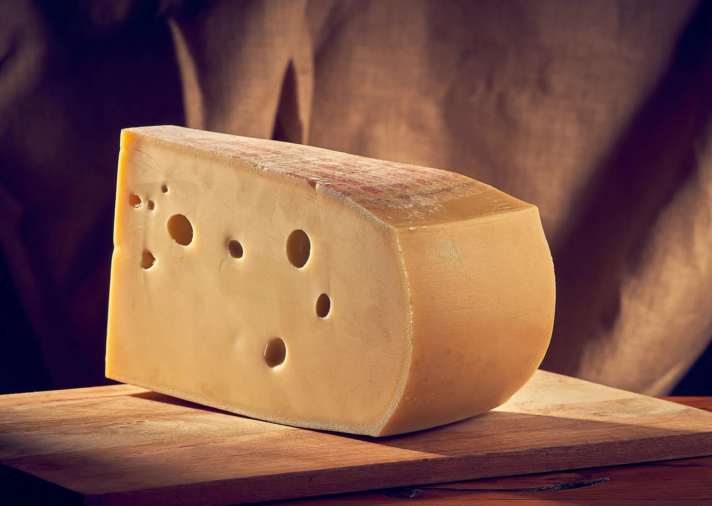 Emmental has characteristic walnut-sized holes created as a result of a complicated fermentation process. The hard thin rind encases a supple, straw yellow interior. The aroma is delicately sweet and nutty with notes of fresh-cut hay. The flavour is very fruity but balanced with acidity.