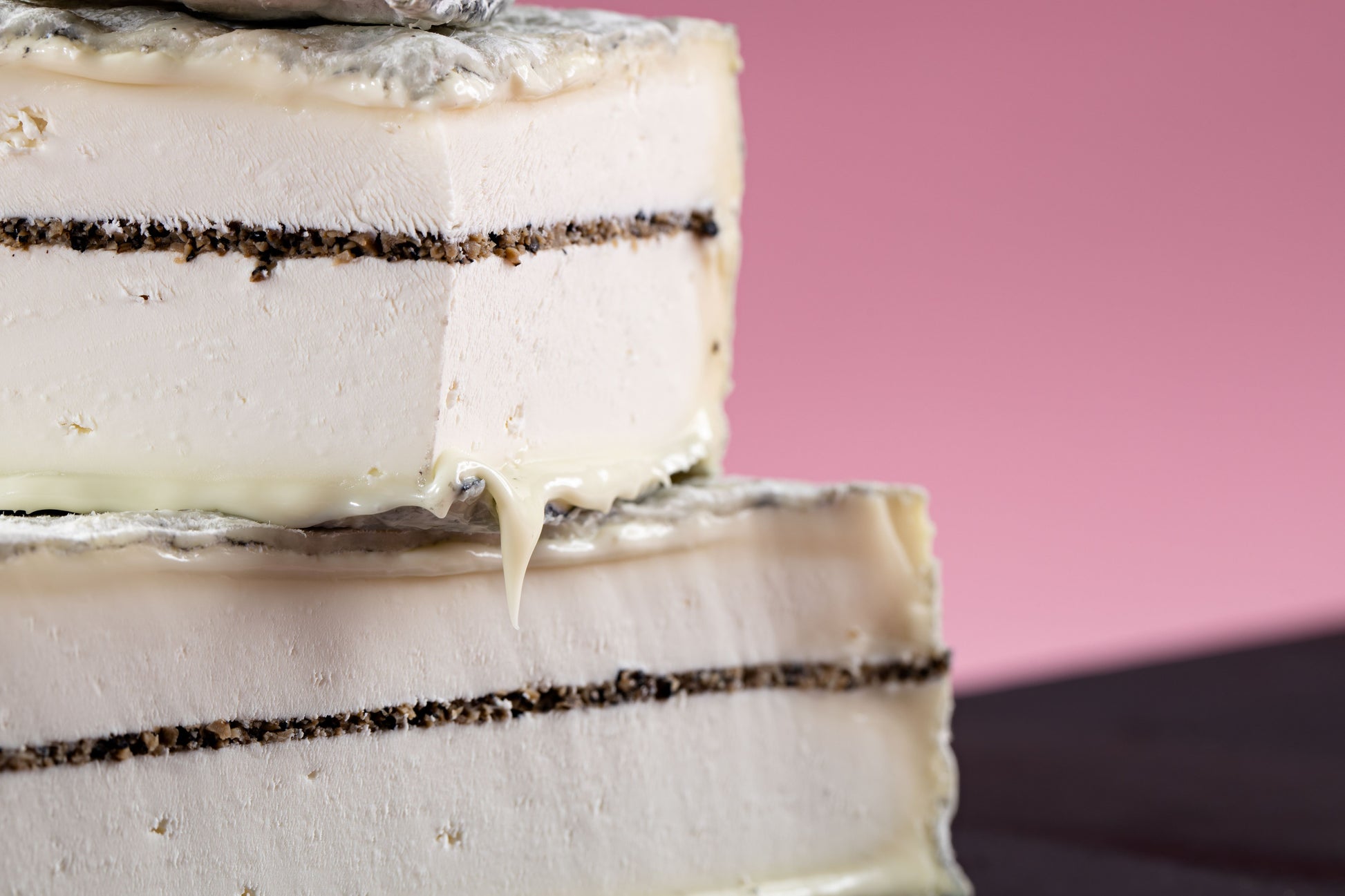 Tomme Adrienne is a soft pasteurised goat milk cheese with a thin layer of summer truffles and lightly coated with ash.  The flavour from the goat milk is very delicate and the subtlety of the summer truffles make for a perfectly balanced combination.