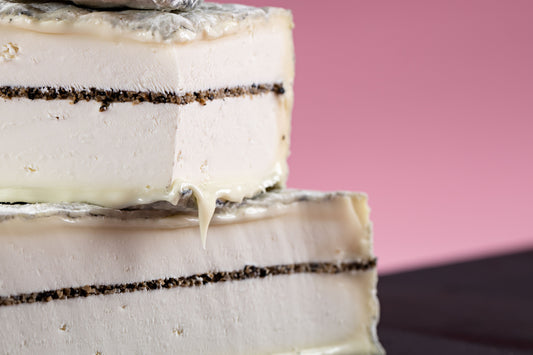 Tomme Adrienne is a soft pasteurised goat milk cheese with a thin layer of summer truffles and lightly coated with ash.  The flavour from the goat milk is very delicate and the subtlety of the summer truffles make for a perfectly balanced combination.