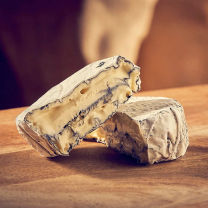 This brie contains a layer of ash in the centre as well as a coating on the outside, making it a striking addition to any cheese board. It has a mild aroma of mushrooms, while the ash adds an extra dimension to create an earthy, nutty finish.