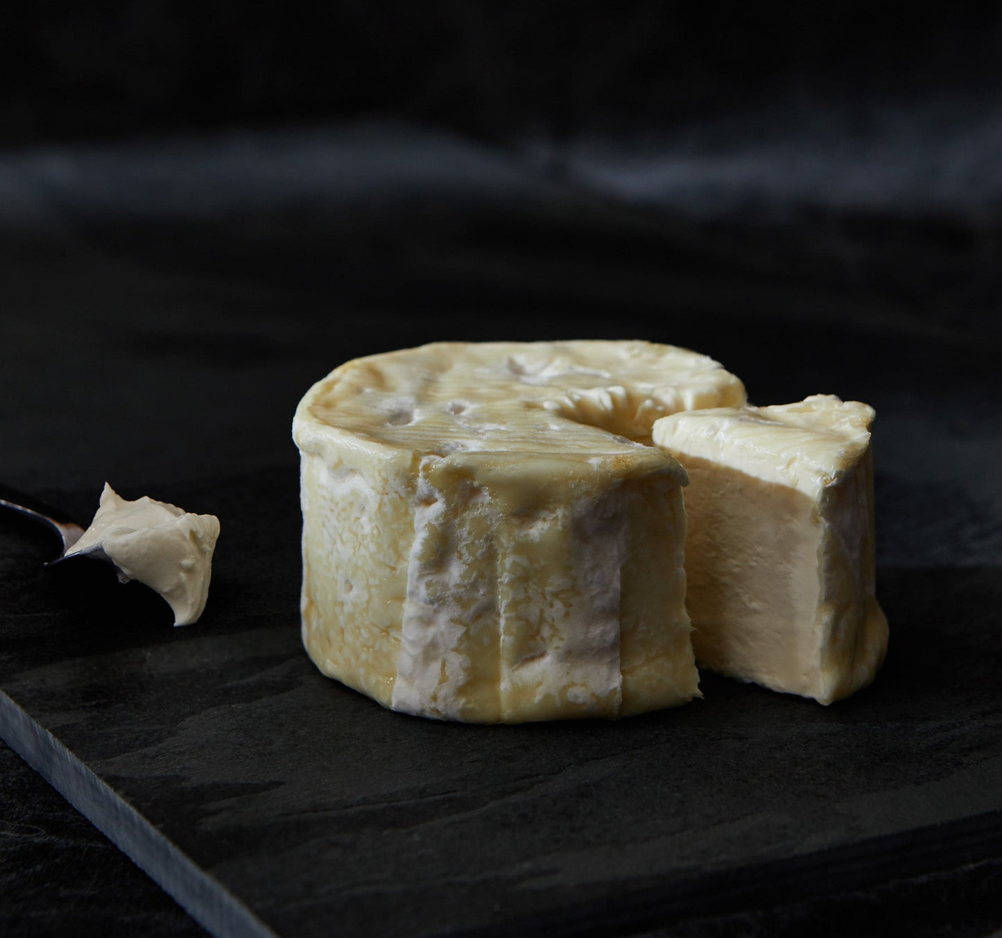 This soft, bloomy rind triple cream is sourced from the Île-de-France in northern central France. The milk is enriched with ripened cream and then made using traditional methods. The fine white rind encases a delicate, savoury but very creamy interior.