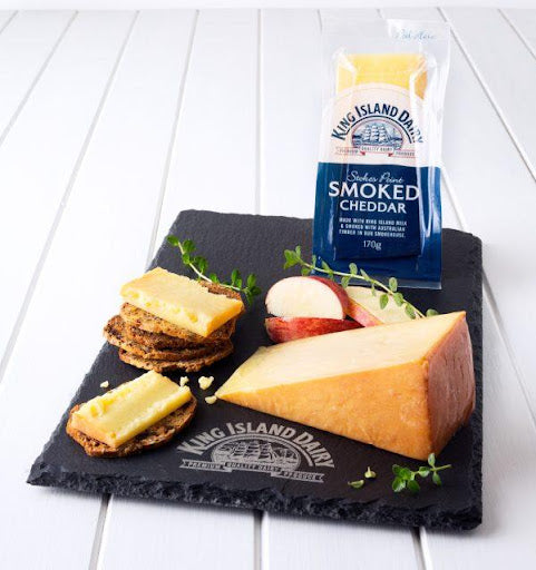 King Island Dairy Cheddar is matured for nine months then naturally smoked with Tasmanian hardwood. The golden rind created during smoking acts as a natural preservative. The cheese has an open texture and a rich smoky flavour reminiscent of good bacon.