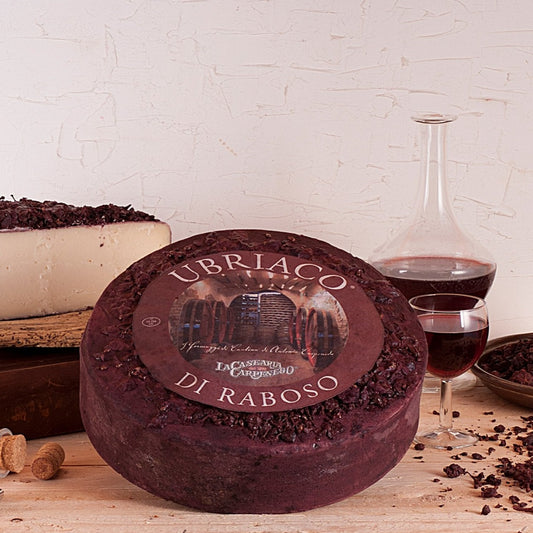 This cheese takes its name from ubriaco, the Italian word for drunk. The wheels are initially ripened in maturation rooms, and then the rind is thoroughly cleaned before being transferred to the übriacatura where it is immersed in rich red Raboso IGT wine and marc. The rind takes on a deep, dusty purple hue from the wine while the paste remains pale straw yellow. It has a gentle tanginess, with a pleasant winey aftertaste.