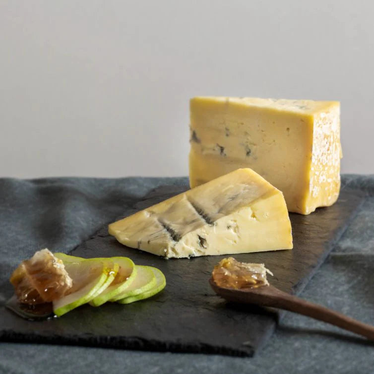 David and his friend Richard Thomas set to work creating a hand-made blue cheese that was inspired by Italian Gorgonzola Dolce. The result is this mild, creamy soft blue with a distinct salty tang that has been converting non blue eaters since 1988.