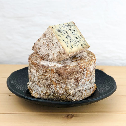 It has a soft brown rind with specks of yellow and orange. Deep blue & green openings are evenly dispersed throughout the soft & light textured interior. The flavour is complex and elegantly balanced with a creamy, rich texture.