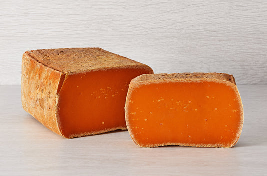 However, inside its thick rind is a bright orange cheese in the Mimolette style. The texture is smooth and compact and the flavour salty at first then tending to nutty.