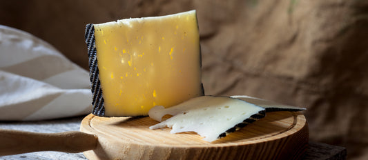 These wheels come to us at twelve months of age and are cared for in our maturing room until sold. Each wheel is checked and turned each week during this time. The end result is a cheese of firm, dry texture, nutty and peppery flavours and a lovely long finish.