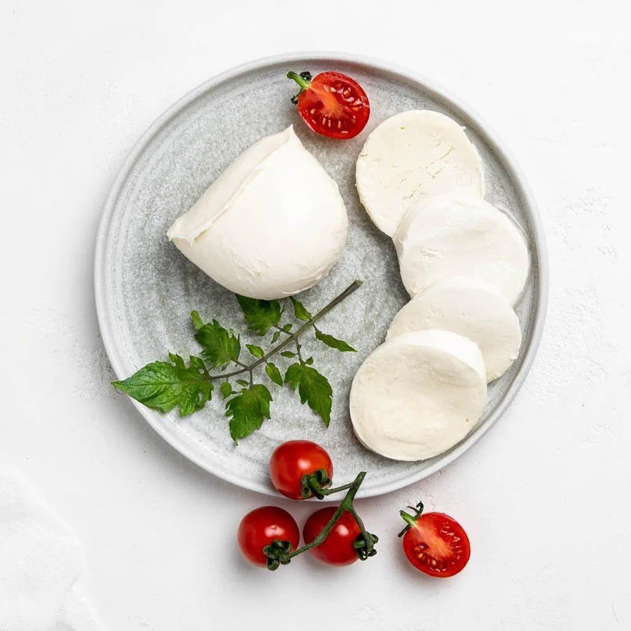 This plump soft cow's milk version of mozzarella has a mild, milky flavour and a supple texture. When cut, a few drops of milky whey may exude from the cheese’s interior.