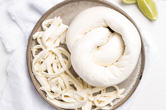 Also known as quesillo or Mexican string cheese, this fresh stretched curd cheese has a flavour and texture similar to fresh mozzarella - mild and milky with a subtle tang.