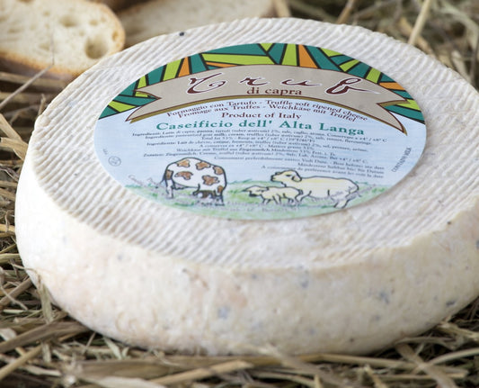 Slightly ripened, this soft cheese has a generous amount of black truffle pieces mixed through the curd. It has a soft, pale rind, and lusciously fudgy, flavoursome interior which develops into a gooey, sticky ooze with a little age.