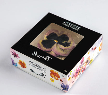 This gorgeous cheese is made using beautiful fresh chèvre, which is first coated in a selection of special herbs to season the cheese. The finishing touch is a selection of edible organic flowers. The result is a work of art which lives up to its name.