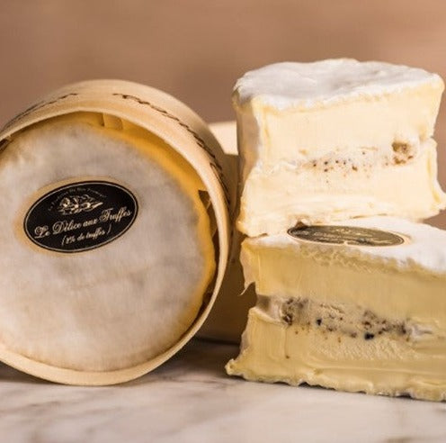 This is a special version of a decadently rich cheese that hails from Burgundy. It is made using milk that is enriched with crème frâiche and then filled with a mixture of mascarpone and truffles. The fluffy white rind allows the cheese to develop its characteristic rich flavour. 